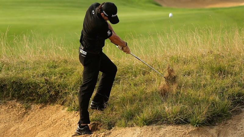 Rory McIlroy grabbed seven birdies for a 65 that lifted him to 12 under