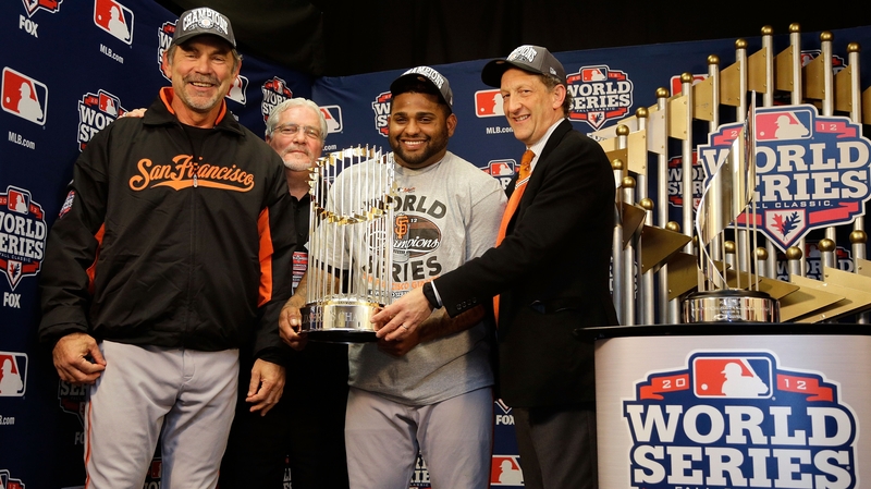 The World Series trophy is handed over