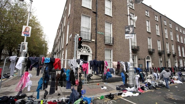 Discarded clothing litters a street after the race