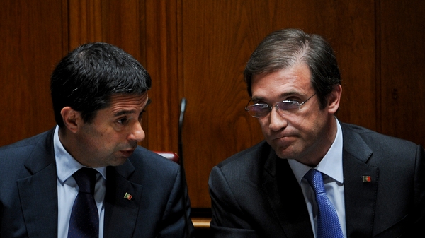 Portuguese Prime Minister Pedro Passos Coelho (R) said Portugal needed to 'turn the page'