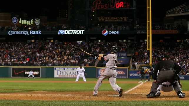 Marco Scutaro of the San Francisco Giants hits the RBI single that wins the World Series in the 10th inning of Game 4 against Detroit