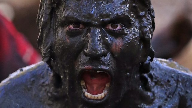 Participants pose for photographs during the Tough Mudder event at Raceway Park in the UK