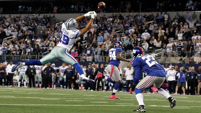 Miles Austin of the Dallas Cowboys reaches for what would have been a game-ending pass against the New York Giants