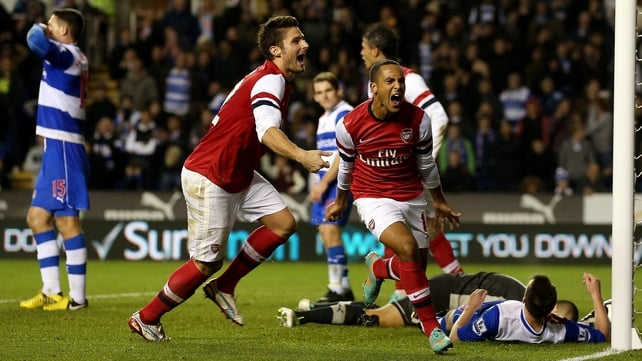 Theo Walcott celebrates scoring Arsenal's sixth goal against Reading in the English League Cup