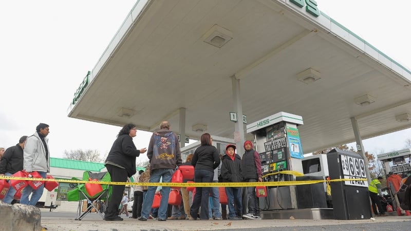 New Jersey residents queue for fuel at one of the few petrol stations that has remained open