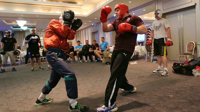 Michael Conlan fends off Ireland hooker Sean Cronin