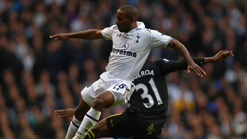 Wigan's Maynor Figueroa tackles Jermain Defoe of Tottenham