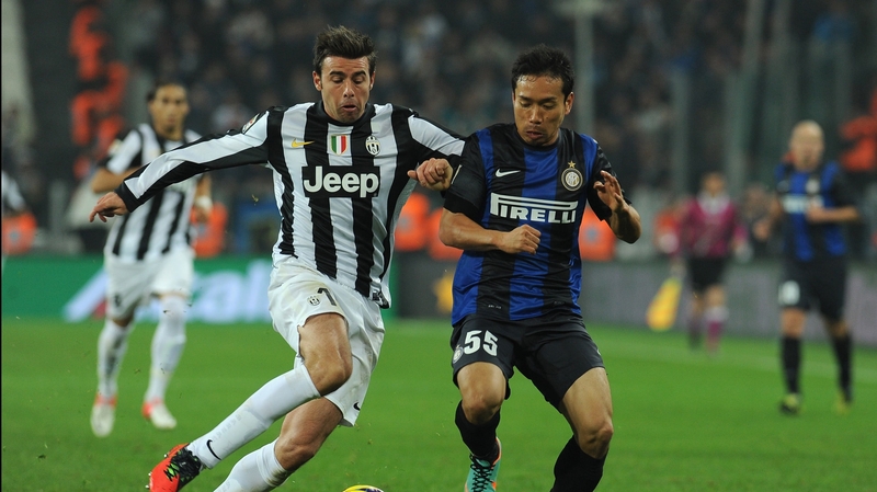Andrea Barzagli (l) of Juventus competes with Yuto Nagatomo of Inter Milan