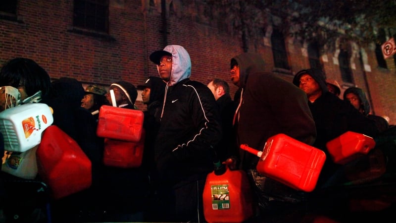 Crowds wait for free gas at the Bedford Avenue Armory in the Brooklyn borough of New York City