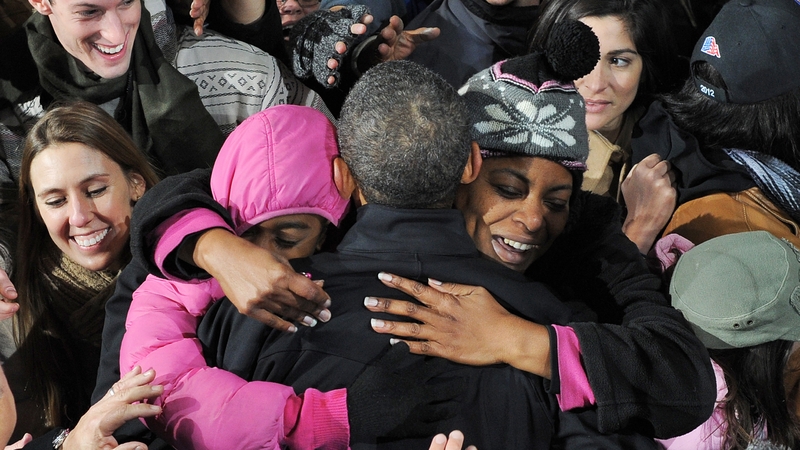 US President Barack Obama (C) greets supporters during a campaign rally at Jiffy Lube Live in Bristow, Virginia