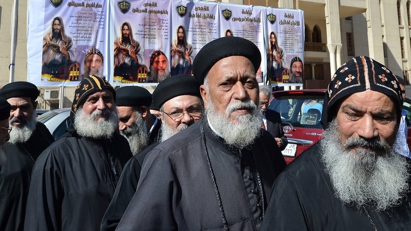 Egyptian Coptic Christian bishops and priests queue to vote for a new spiritual leader at Saint Mark's Coptic Cathedral in Cairo's al-Abbassiya district on 29 October