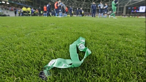 A runners-up medal lying in the grass after being thrown away by a St Patrick's Athletic player