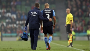 Jake Carroll of Pat's was forced to leave the pitch with an injury