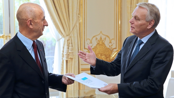 Louis Gallois (L) handing his report to French minister Jean Marc Ayrault