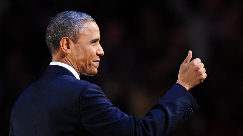 US President Barack Obama salutes the crowd at victory speech in Chicago