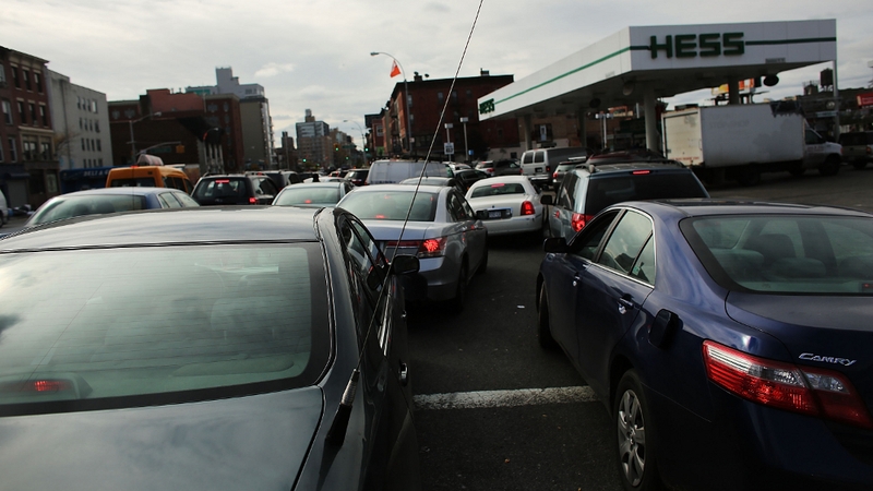 People wait in line for over two hours at a petrol station in New York City