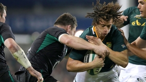 South Africa full-back Zane Kirchner is stopped by Cian Healy