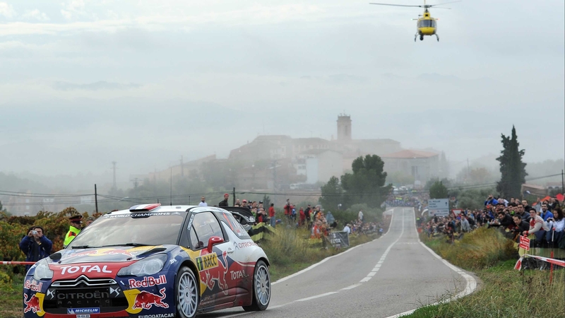 Sebastien Loeb flanked by a helicopter in Salou, Spain