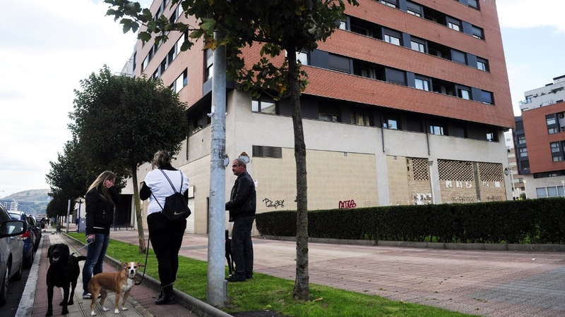 People chat close to the place where Amaia Egana took her own life in Barakaldo
