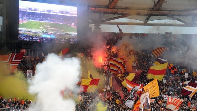 Roma fans play their part during the hotly contested Rome derby against Lazio at the Stadio Olimpico