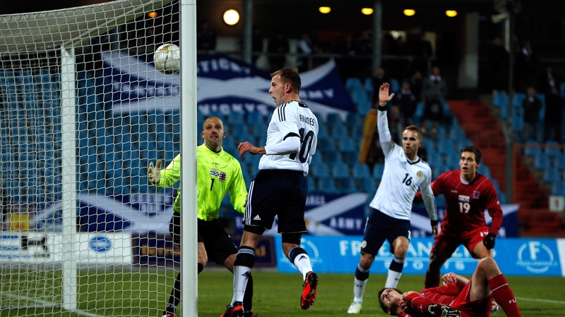 Jordan Rhodes of Scotland heads home the first goal of the game against Luxembourg