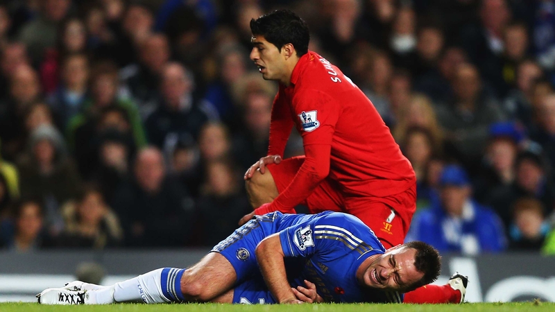 Terry in a heap after his collision with Luis Suarez at Stamford Bridge