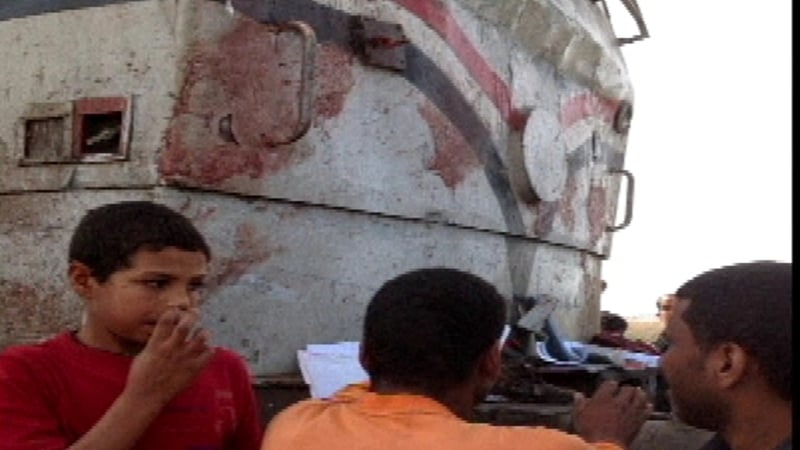 Blood stains are visible on the front of the train, which hit a bus carrying school children