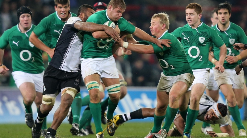 Chris Henry drives at the Fiji defence