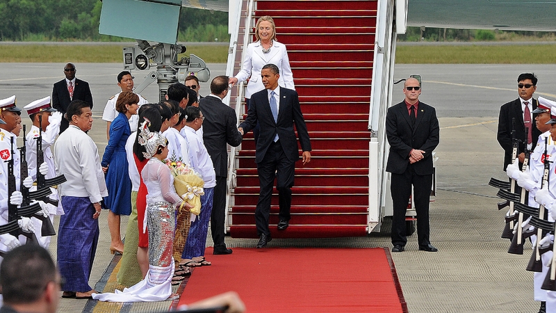 Mr Obama shakes hands with Derek Mitchell, the US ambassador to Burma