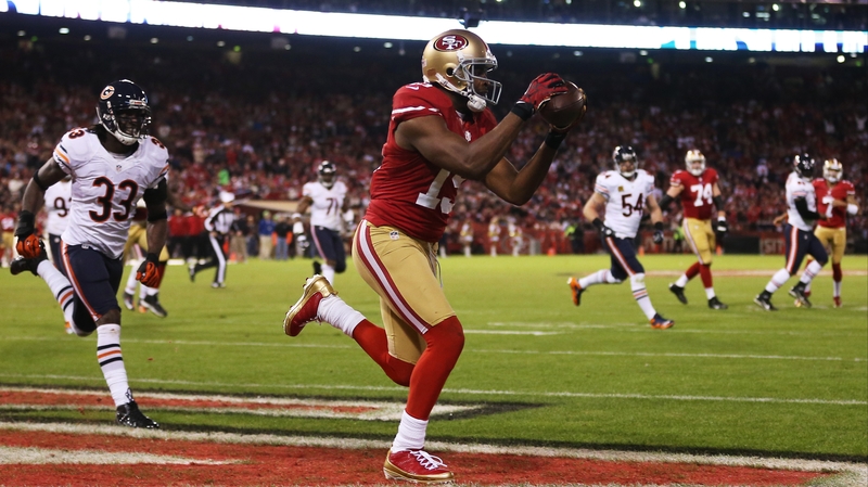 Michael Crabtree catches a third-quarter touchdown as San Francisco 49ers eased past the Chicago Bears at Candlestick Park