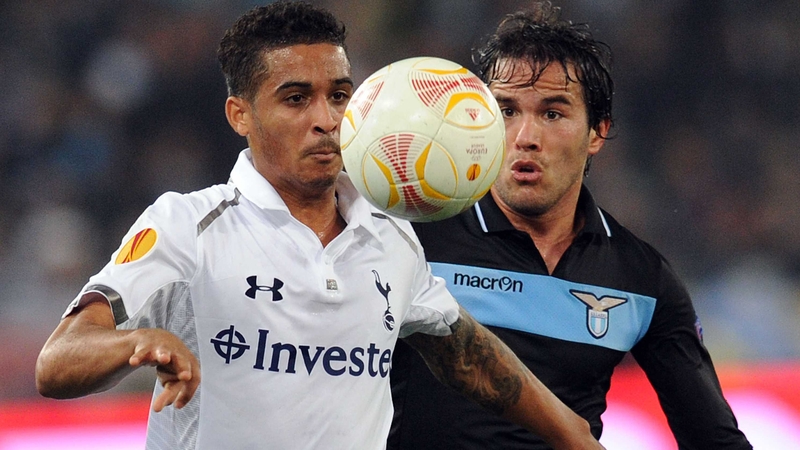 Kyle Naughton of Tottenham and Alvaro Gonzales challenge for the ball