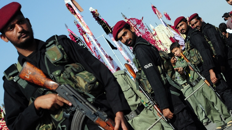 Pakistani special police force members guard a Shia Muslim procession in Karachi