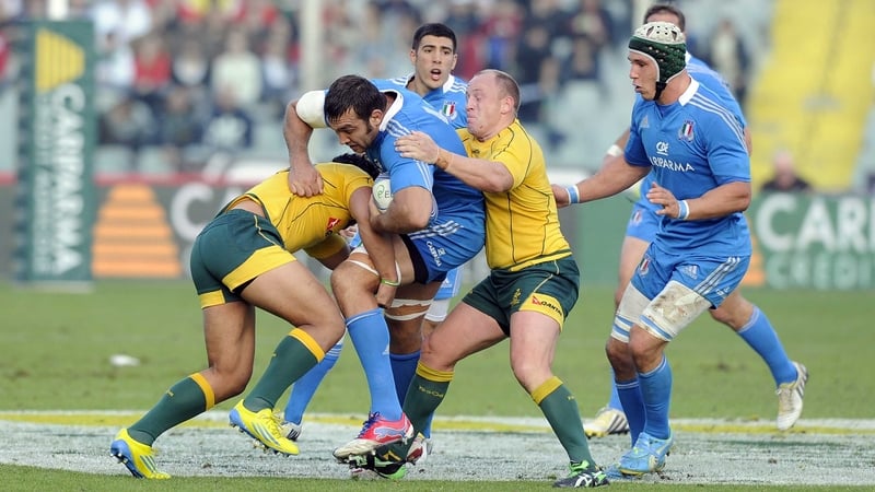 Italy's Quintin Geldenhuys is contained by Australia