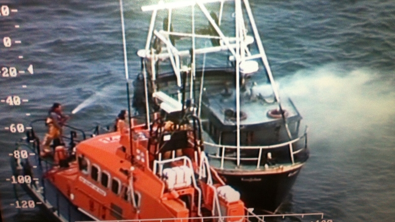 The Dunmore East Lifeboat attempts to extinguish the fire on the 'Kingfisher' (Pic: Irish Coastguard)