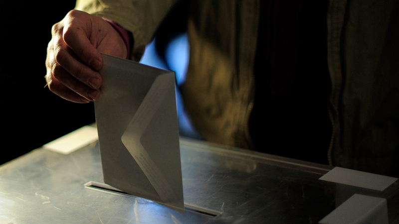 A man casts his ballot for regional elections in Barcelona