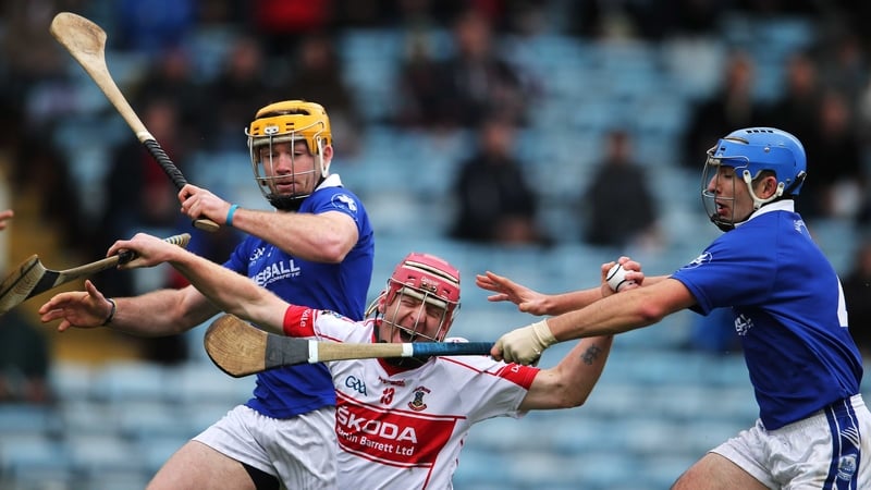 John Mullane of De La Salle under pressure from Padraic Maher and David Maher of Thurles Sarsfields