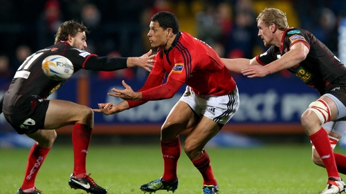 Doug Howlett offloads under pressure from Scarlets tryscorer Andy Fenby