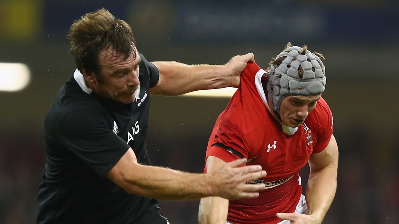 Jonathan Davies spills the ball under the challenge of Andrew Hore