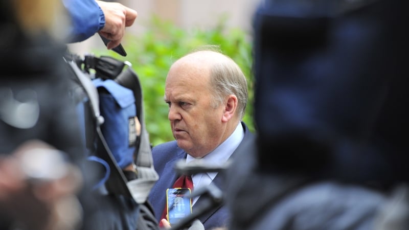 Minister for Finance Michael Noonan answers the media upon his arrival yesterday