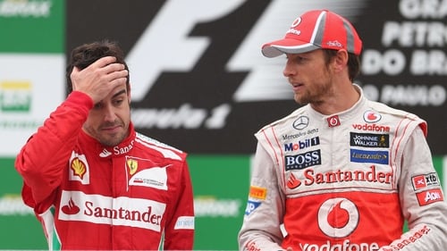 Jenson Button (R) still waiting to hear if he's losing his McLaren seat upon Fernando Alonso's imminent return to the team