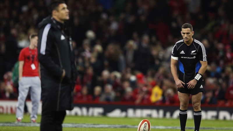 Injured Daniel Carter looks on as Aaron Cruden warms up before the match at the Millennium Stadium