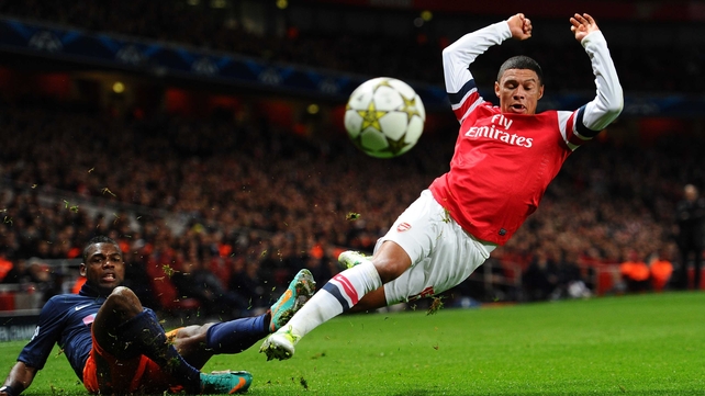 Alex Oxlade-Chamberlain of Arsenal is brought down by Henri Bedimo Nsame of Montpellier during a UEFA Champions League Group B match