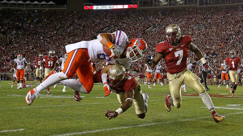 Trey Burton of the Florida Gators is forced out of bounds by Terrence Brooks of the Florida State Seminoles during a game at Doak Campbell Stadium