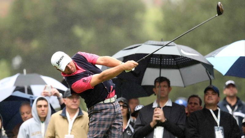Graeme McDowell hits his tee shot on the second hole earlier today
