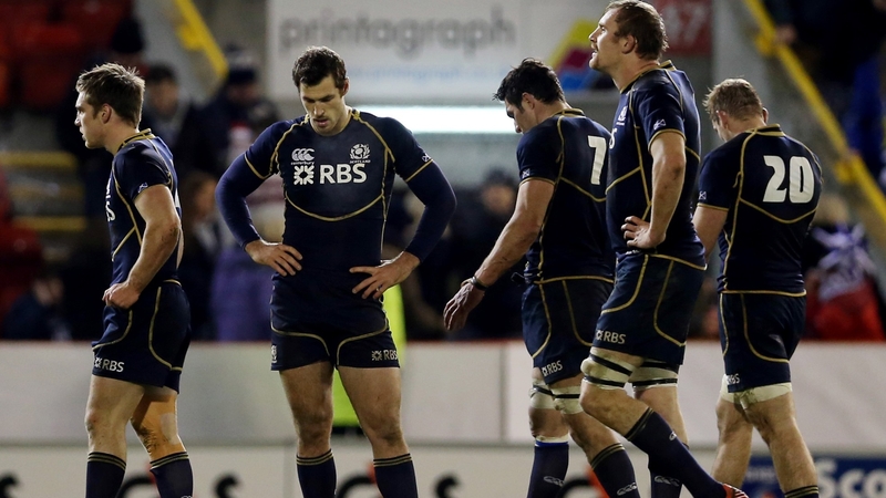 Scottish players show their dejection after the defeat to Tonga