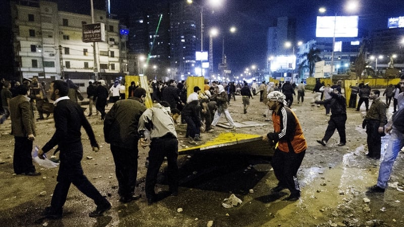 Trouble broke out when Islamist supporters of Mohammed Mursi marched on his palace, confronting members of the opposition who were holding a sit-in