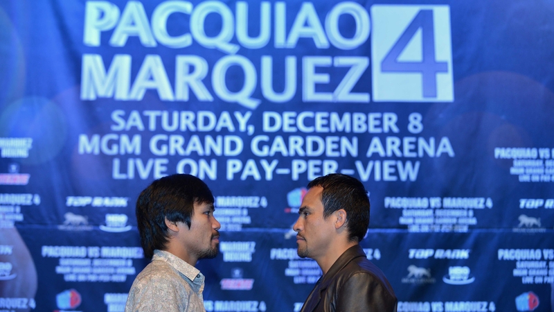 Manny Pacquiao (L) and Juan Manuel Marquez (R) face off at a press conference