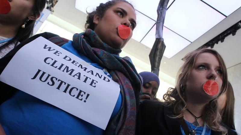 Local and international activists to demanded urgent action to address climate change at the UN climate talks in Doha