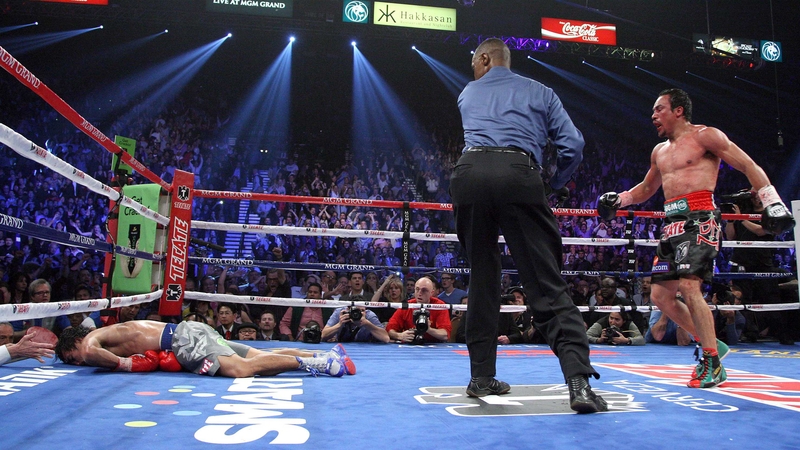 Manny Pacquaio lies on the canvas after being hit by a stunning counter-punch from Juan Manuel Marquez