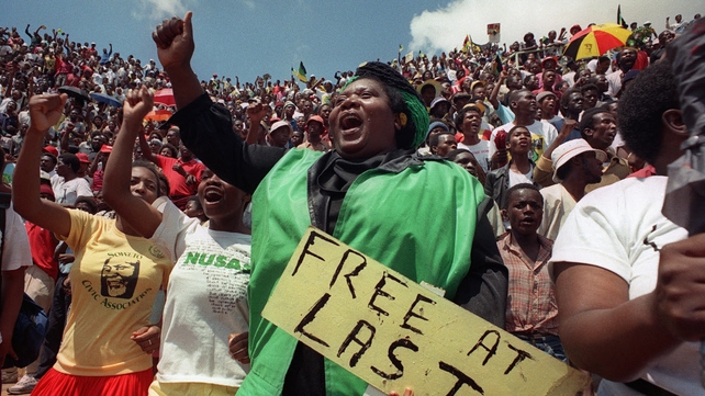 Jubilant inhabitants of Soweto attend a mass ANC event to be addressed by Nelson Mandela at Orlando stadium in Soweto in 1990